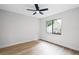 Bedroom with wood floors and a large window allowing natural light to fill the room at 1121 Northern Way, Winter Springs, FL 32708