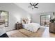 Bright and airy bedroom with a plush bed, neutral tones, and access to the backyard at 1121 Northern Way, Winter Springs, FL 32708