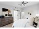 Modern bedroom featuring a barn door, ceiling fan and stylish decor at 1121 Northern Way, Winter Springs, FL 32708