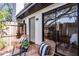 Private deck with wicker chairs offers a cozy outdoor seating area at 1121 Northern Way, Winter Springs, FL 32708