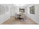 Dining room with a modern chandelier and a large window that provides ample natural light at 1121 Northern Way, Winter Springs, FL 32708