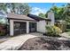 Well-maintained exterior of home with screened patio and landscaped walkway at 1121 Northern Way, Winter Springs, FL 32708