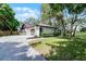 Charming single-story home with lush landscaping, mature trees, and a welcoming front yard at 1121 Northern Way, Winter Springs, FL 32708