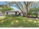 Charming single-story home with lush landscaping, mature trees, and a well-maintained front yard at 1121 Northern Way, Winter Springs, FL 32708