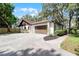 Attractive home featuring a paved driveway and a large two-car garage at 1121 Northern Way, Winter Springs, FL 32708