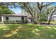 Charming single-story home with lush landscaping, mature trees, and a well-maintained front yard at 1121 Northern Way, Winter Springs, FL 32708