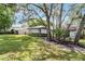 Charming single-story home with lush landscaping, mature trees, and a well-maintained front yard at 1121 Northern Way, Winter Springs, FL 32708