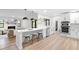 Bright, modern kitchen with stainless steel appliances, white cabinets, and a stylish breakfast bar at 1121 Northern Way, Winter Springs, FL 32708