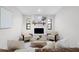 Bright living room with white brick fireplace and contemporary furnishings offers a cozy and inviting atmosphere at 1121 Northern Way, Winter Springs, FL 32708