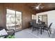 Covered patio features dining table, lounge chairs, and easy indoor/outdoor living at 1121 Northern Way, Winter Springs, FL 32708