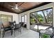 Covered patio with dining area and wicker seating, offering relaxing outdoor living space at 1121 Northern Way, Winter Springs, FL 32708