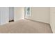 The bedroom has neutral walls, baseboards, and carpet, with a window and closet at 14425 Huntingfield Dr, Orlando, FL 32824