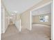 Spacious carpeted hallway leading to various rooms in the home at 14425 Huntingfield Dr, Orlando, FL 32824