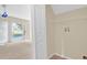 The laundry room has a shelf and beige walls with tan flooring at 14425 Huntingfield Dr, Orlando, FL 32824