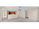 Open-concept living area with views of kitchen, stairway, and backyard at 14425 Huntingfield Dr, Orlando, FL 32824