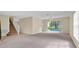 Open concept floor plan with a staircase and sliding glass doors to the pool at 14425 Huntingfield Dr, Orlando, FL 32824