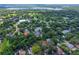 Enjoy the serenity from above; this home is nestled in a lush, tree-filled area close to the lake and local services at 1503 Granite State Ct, Mount Dora, FL 32757