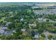 Aerial shot of a property surrounded by trees, with easy access to nearby amenities and recreational areas at 1503 Granite State Ct, Mount Dora, FL 32757