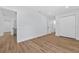 A bright bedroom with wood floors and white walls at 1503 Granite State Ct, Mount Dora, FL 32757