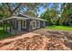Charming single-story home with a brick driveway and covered entrance at 1503 Granite State Ct, Mount Dora, FL 32757