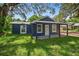 Cozy home features a quaint porch and inviting curb appeal at 1503 Granite State Ct, Mount Dora, FL 32757