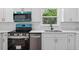 Close-up of a kitchen with stainless steel appliances and modern countertops at 1503 Granite State Ct, Mount Dora, FL 32757