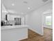 Bright kitchen with white cabinetry, stainless steel appliances, and modern countertops at 1503 Granite State Ct, Mount Dora, FL 32757