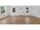 Inviting living room with natural light, hardwood floors, and neutral décor at 1503 Granite State Ct, Mount Dora, FL 32757
