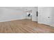 Open-concept living space with hardwood floors and seamless flow to the kitchen area at 1503 Granite State Ct, Mount Dora, FL 32757