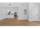 Bright and open living room with hardwood floors and seamless flow to the kitchen at 1503 Granite State Ct, Mount Dora, FL 32757
