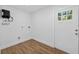 Utility room features a door to outside and hot water tank at 1503 Granite State Ct, Mount Dora, FL 32757