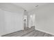 Spacious bedroom with closet, gray flooring, and view of ensuite bathroom at 15684 Sw 37Th Cir, Ocala, FL 34473