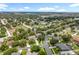 A sprawling residential community with lush greenery and manicured lawns under a bright blue sky at 1602 Presidio Dr, Clermont, FL 34711