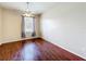 Bright bedroom with ceiling fan, window, and hardwood floors creates a warm, inviting space at 1602 Presidio Dr, Clermont, FL 34711