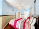 Generous primary bedroom with hardwood floors, a fan, and soft lighting at 1602 Presidio Dr, Clermont, FL 34711