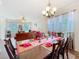 Open dining room with a view into the living room, modern lighting and stylish setting at 1602 Presidio Dr, Clermont, FL 34711