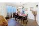 Dining room featuring elegant table, chandelier, and view to the kitchen at 1602 Presidio Dr, Clermont, FL 34711