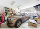 Garage featuring a vehicle, shelving and lots of storage space at 1602 Presidio Dr, Clermont, FL 34711