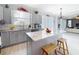 Kitchen featuring stainless steel appliances, a granite island, and grey cabinets at 1602 Presidio Dr, Clermont, FL 34711