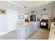 Modern kitchen with marble counters, an island, and stainless steel appliances at 1602 Presidio Dr, Clermont, FL 34711