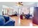 Spacious main bedroom featuring hardwood floors, comfortable bed, ceiling fans, and an office area at 1602 Presidio Dr, Clermont, FL 34711