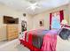 Bedroom with a ceiling fan, a large window, and a walk-in closet provides ample space at 1602 Presidio Dr, Clermont, FL 34711