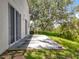 Back patio area with sliding glass doors that lead to the yard at 1602 Presidio Dr, Clermont, FL 34711