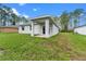 Exterior view of the backyard featuring a covered patio at 1765 9Th Ave, Deland, FL 32724