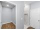 Modern bathroom showcasing open closet and marble walk-in shower with tiled floors at 1765 9Th Ave, Deland, FL 32724