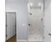 Modern bathroom featuring marble walk-in shower with tiled floors and glass door at 1765 9Th Ave, Deland, FL 32724