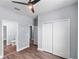 This bedroom featuring hardwood floors, a modern ceiling fan, access to the bathroom, and a closet at 1765 9Th Ave, Deland, FL 32724