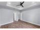 Bedroom featuring hardwood floors, with multiple doors to the bathroom and other rooms at 1765 9Th Ave, Deland, FL 32724