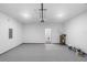 Spacious garage with epoxy floors, recessed lighting, water heater and electrical panel at 1765 9Th Ave, Deland, FL 32724