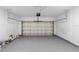 Spacious two car garage with a light gray epoxy floor at 1765 9Th Ave, Deland, FL 32724